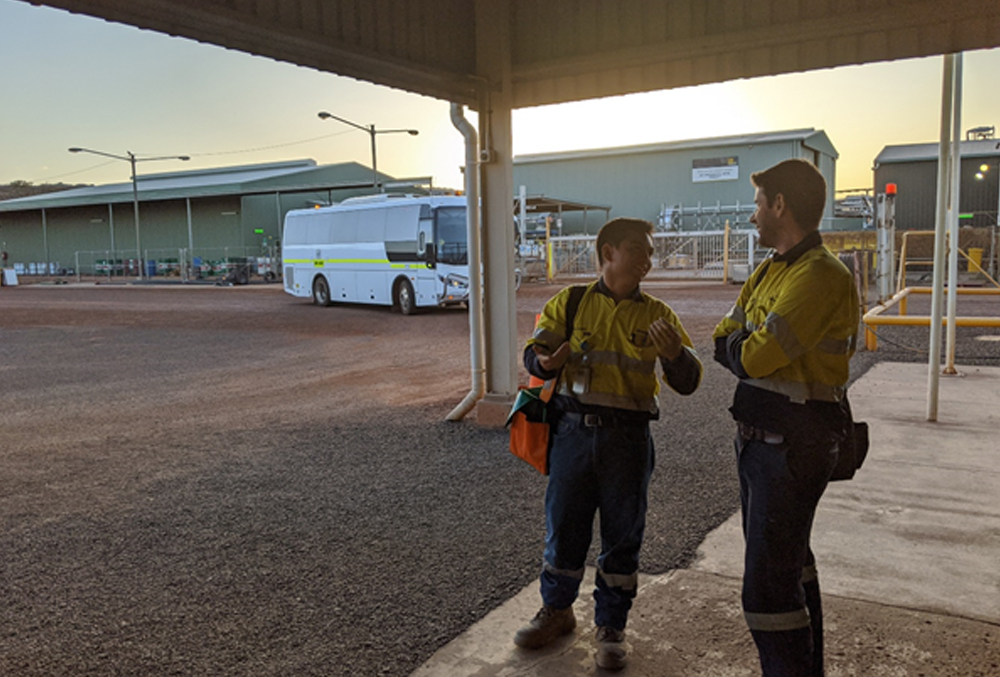 Newmont Goldcorp graduate Lawrence Alago waiting for the bus back to the camp