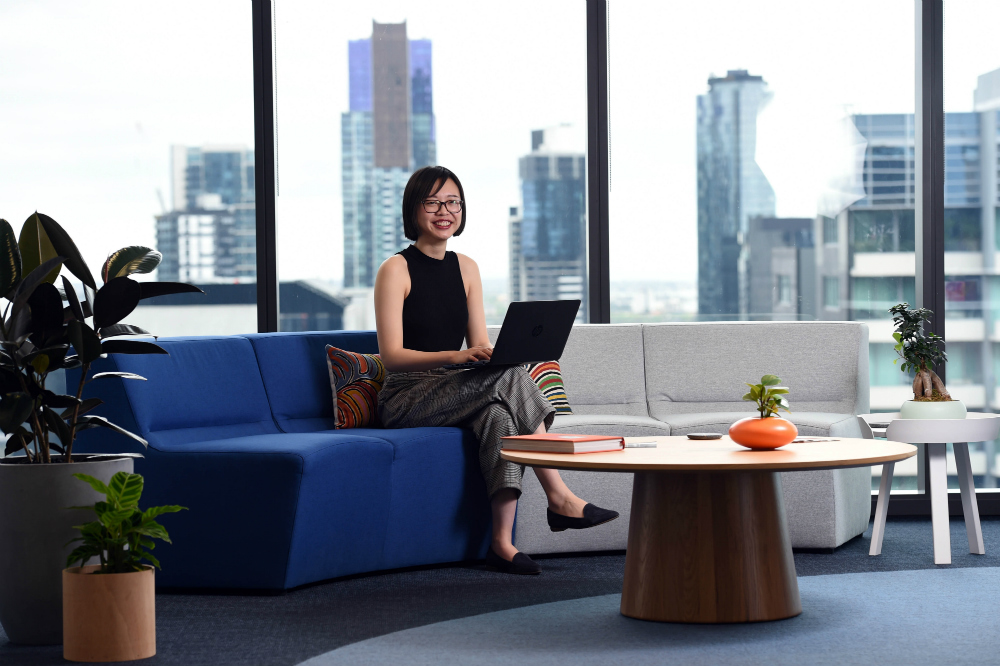 Nous Group Jenny Shen with her laptop