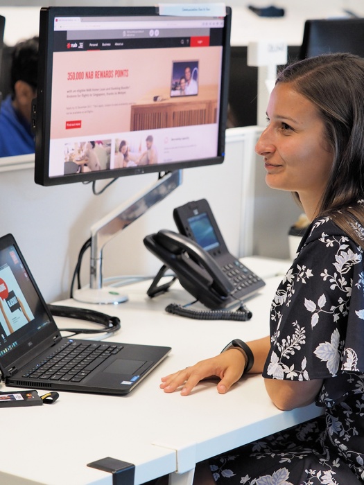 NAB Graduate at her desk