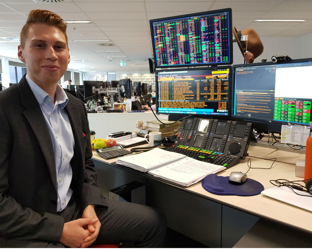 NAB Graduate working at his desk