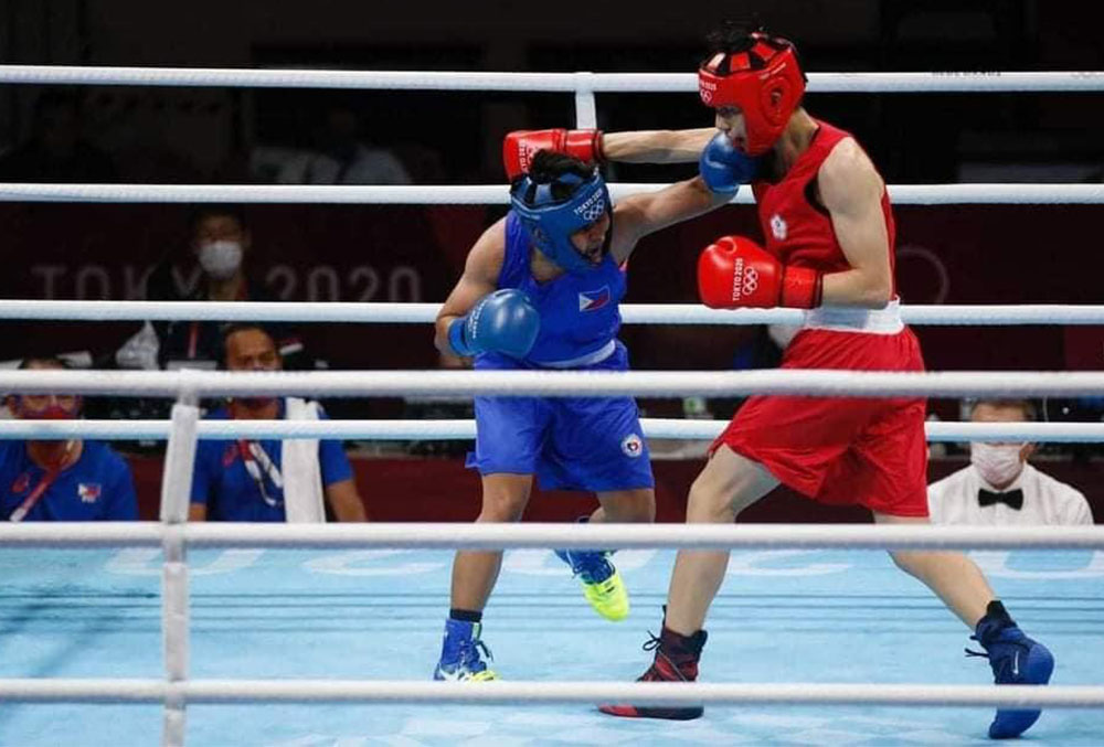 athletes in a boxing ring