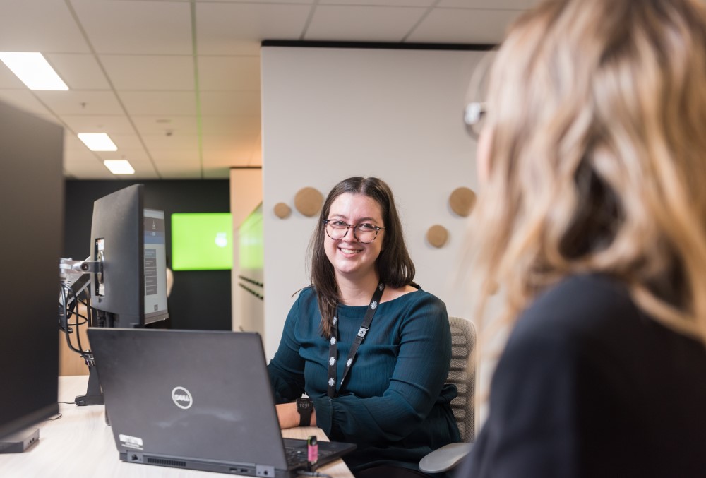 Australian National Audit Office (ANAO) Graduate - Female professional working on her laptop.