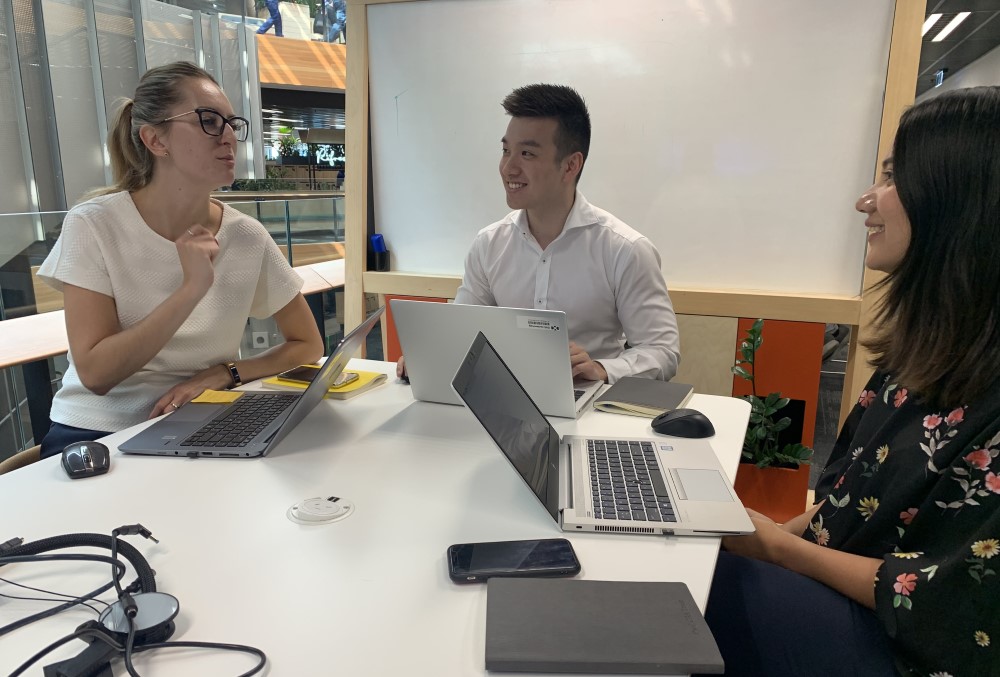PwC Graduate - Male graduate meeting with his team