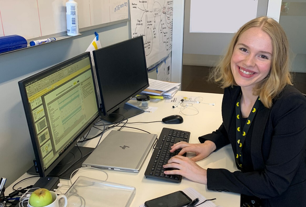 RAA Graduate Geena Suphke  at her desk