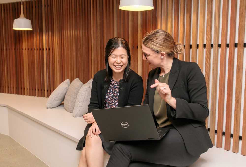 Worley Graduate - Young female professional working with her colleague.