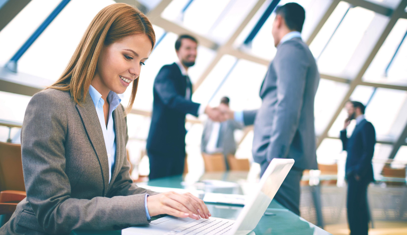 Investment banker in front of a laptop