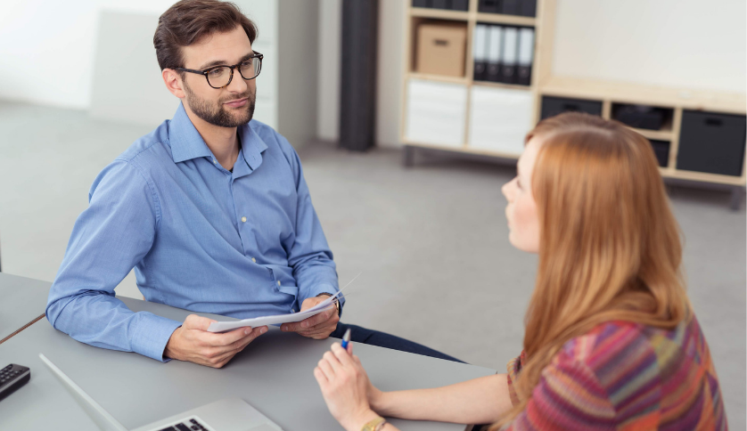A man conducting performance review to a graduate