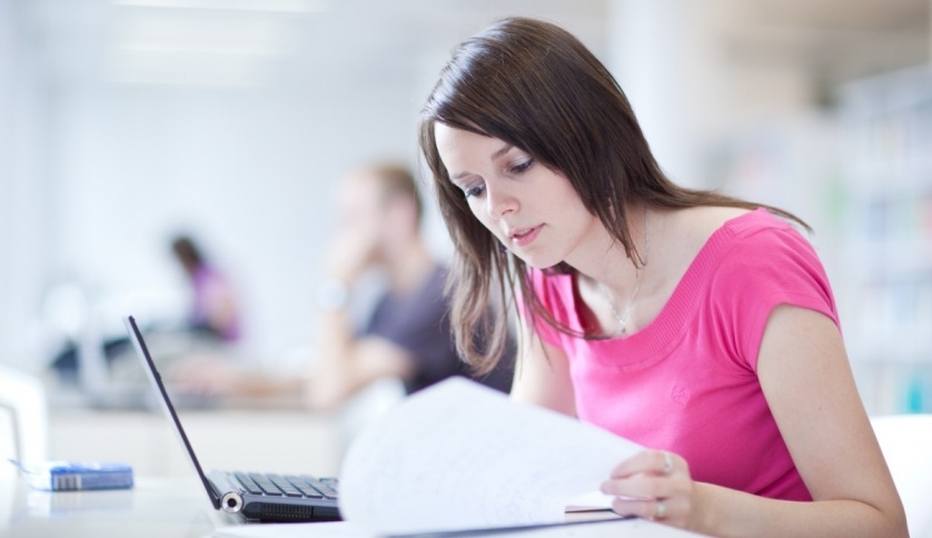 A student studying her notes.